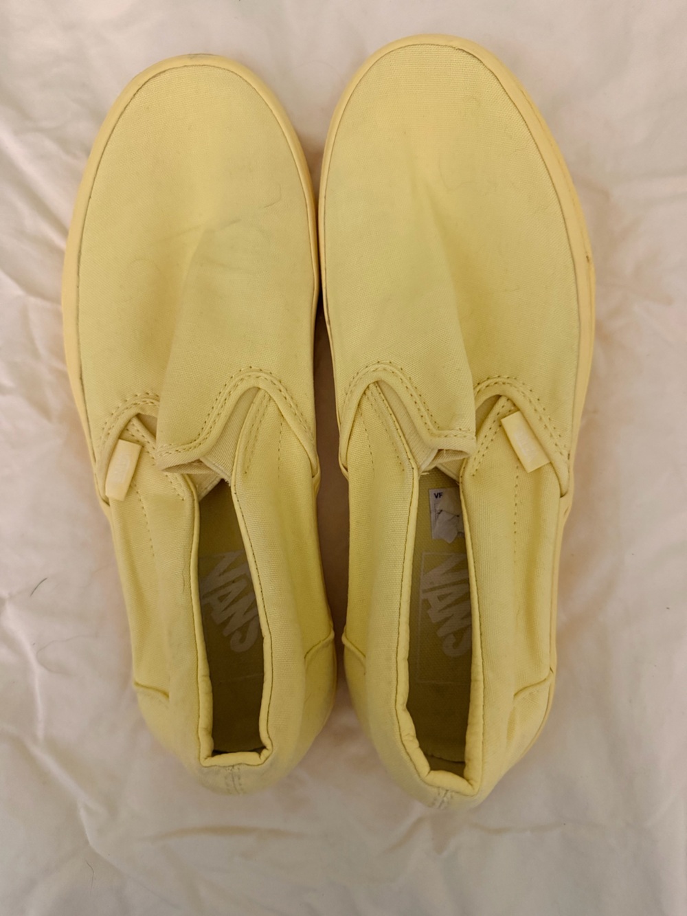 Vans monochromatic Slip-On Canvas Shoes in Pale Yellow
